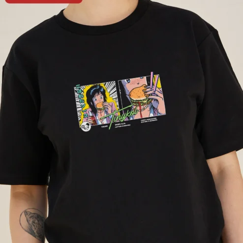Tinykol Year A.H. First Humanoid Eating Burger Graphic Tee Retro Anime Sci-Fi Humor Shirt on a hanger, ready to ship from Chicago, Illinois