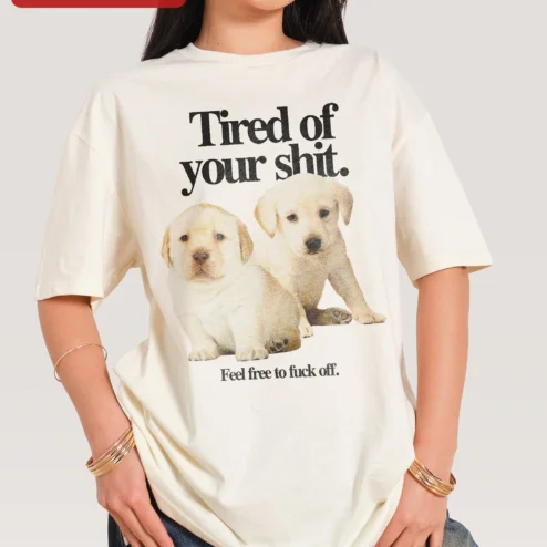 Tired of Your Shit Feel Free to Fuck Off Labrador Puppy Graphic Tee Funny Sarcastic Dog Lover Shirt on a hanger, ready to ship from Chicago, Illinois