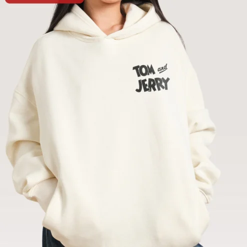 Customer in Chicago, Illinois wearing Tom and Jerry Hoodie Classic Cartoon Character Sweatshirt Retro Pop Culture Merch for Men Women