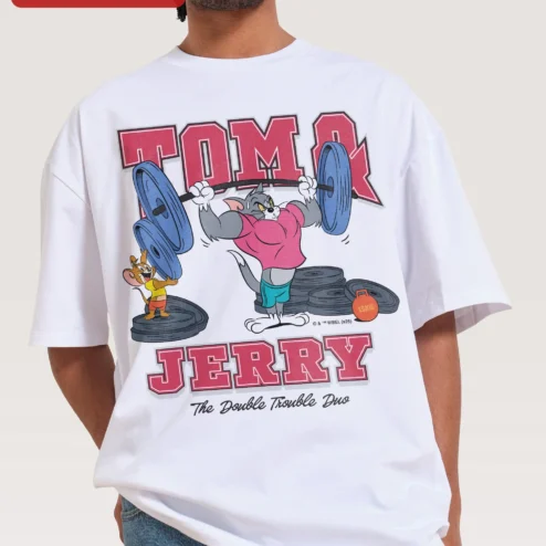 Customer in Chicago, Illinois wearing Tom and Jerry The Double Trouble Duo Graphic Tee Retro Cartoon Bodybuilder Shirt