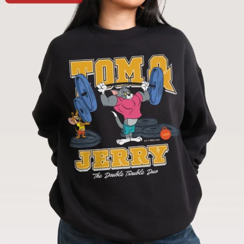 Tom and Jerry The Double Trouble Duo Sweatshirt Retro Cartoon Gym Merch on a hanger, ready to ship from Chicago, Illinois