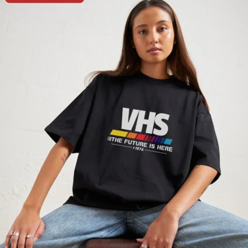 VHS The Future Is Here 1976 Retro Graphic Tee on a hanger, ready to ship from Chicago, Illinois