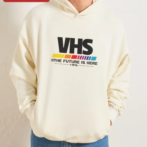 Customer in Chicago, Illinois wearing VHS The Future Is Here Retro Hoodie, Vintage Analog Tech Vaporwave Glitch Art Pullover for Men Women