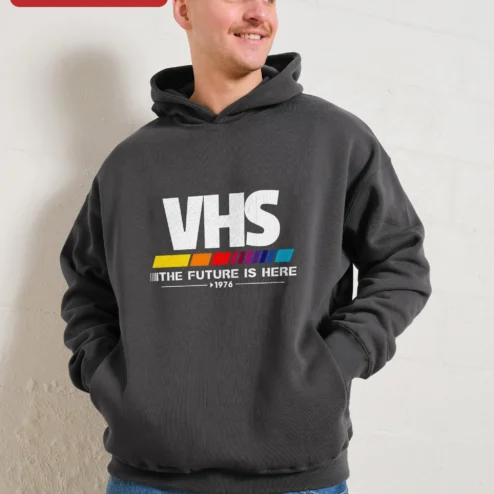 Customer in Chicago, Illinois wearing VHS The Future Is Here Retro Hoodie, Vintage Analog Tech Vaporwave Glitch Art Pullover for Men Women