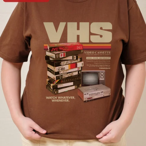 Customer in Chicago, Illinois wearing VHS Vintage Tape Retro Nostalgia Graphic Tee for Men Women Unisex Cotton Shirt