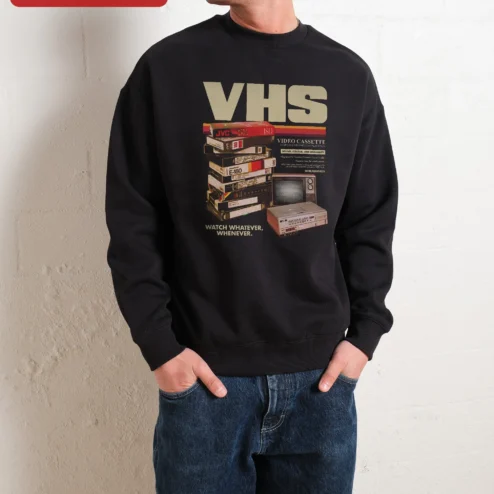 VHS Watch Whatever Whenever Retro Nostalgia Sweatshirt on a hanger, ready to ship from Chicago, Illinois
