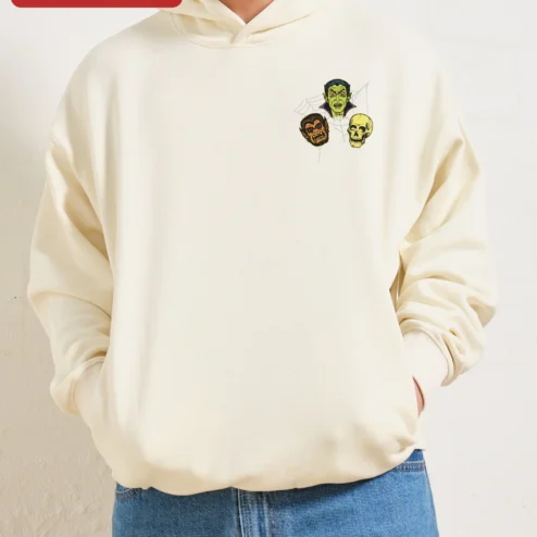 Close-up of Vintage Horror Monster Mash Pullover Hoodie Vampire Werewolf Skull Graphic for streetwear fans in Chicago, Illinois