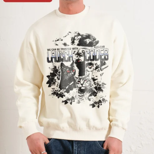 We Can Be Trusted With Nuclear Launch Codes Funny Cat Crewneck Sweatshirt Dark Humor Gift on a hanger, ready to ship from Chicago, Illinois