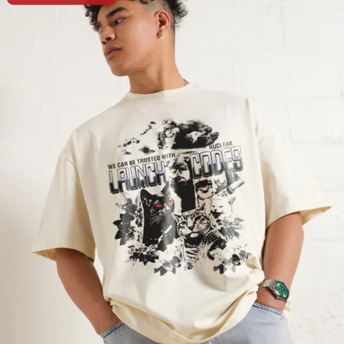 We Can Be Trusted With Nuclear Launch Codes Funny Cat Graphic Tee Dark Humor Oversized Shirt on a hanger, ready to ship from Chicago, Illinois