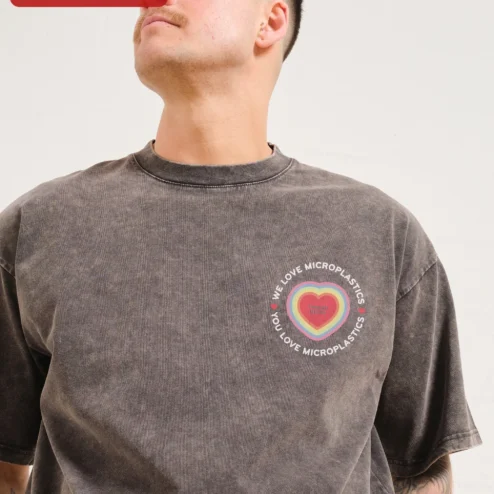 We Love Microplastics You Love Microplastics Acid Wash Tee Funny Eco Meme Shirt on a hanger, ready to ship from Chicago, Illinois