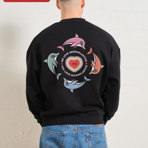 Close-up of We Love Microplastics You Love Microplastics Funny Meme Sweatshirt Retro Dolphin Graphic Crewneck for streetwear fans in Chicago, Illinois