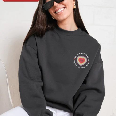 Customer in Chicago, Illinois wearing We Love Microplastics You Love Microplastics Funny Meme Sweatshirt Retro Dolphin Graphic Crewneck