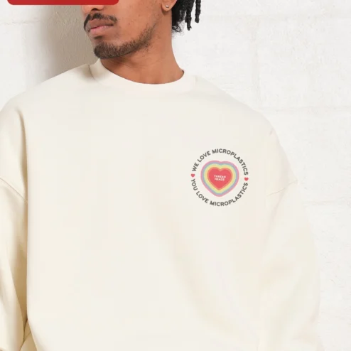 Close-up of We Love Microplastics You Love Microplastics Funny Meme Sweatshirt Retro Dolphin Graphic Crewneck for streetwear fans in Chicago, Illinois