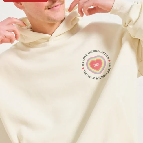 Close-up of We Love Microplastics You Love Microplastics Sarcastic Environmental Hoodie for streetwear fans in Chicago, Illinois