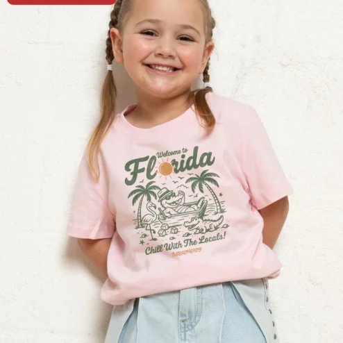 Customer in Chicago, Illinois wearing Welcome to Florida Chill With The Locals Kids Tee Funny Alligator Hammock Graphic Shirt