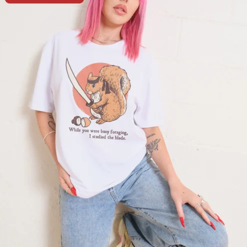 While You Were Busy Foraging I Studied The Blade Squirrel Samurai Tee on a hanger, ready to ship from Chicago, Illinois
