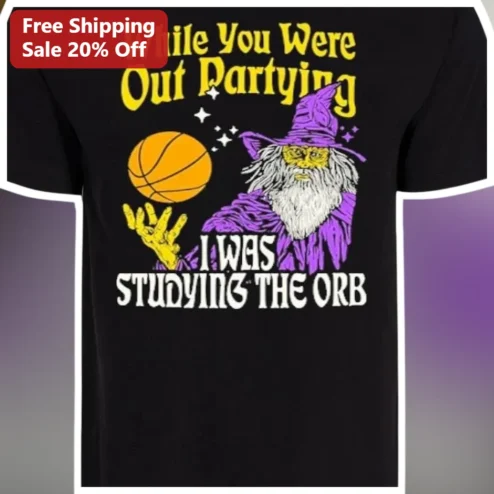 While You Were Out Partying I Was Studying The Orb Basketball Wizard Tee available at our Chicago, Illinois warehouse