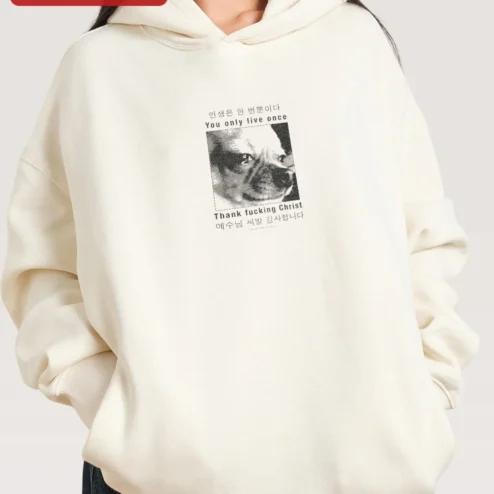 Customer in Chicago, Illinois wearing YOLO You Only Live Once Hoodie Thank Fucking Christ Jesus Bilingual Dark Humor Streetwear